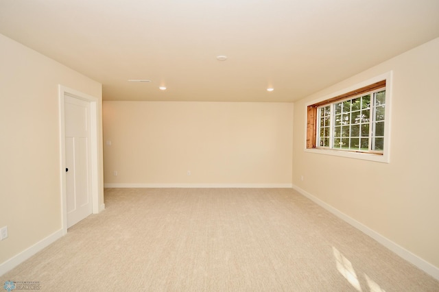 empty room with light colored carpet