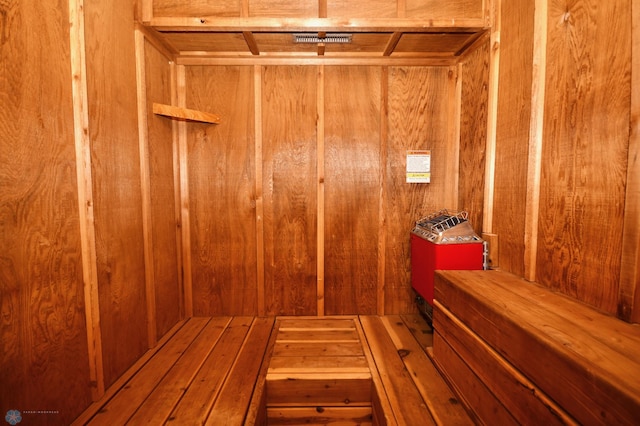 view of sauna / steam room with wooden walls