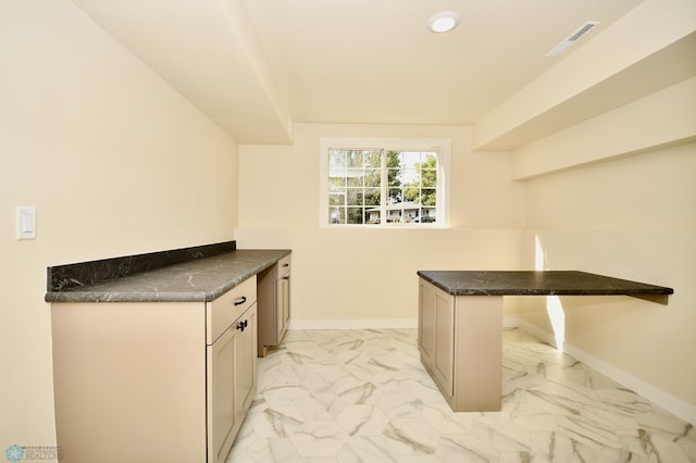 interior space featuring kitchen peninsula and a breakfast bar