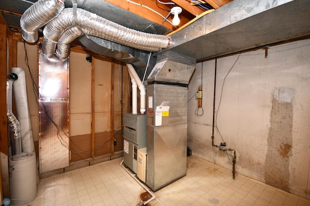 utility room with heating unit