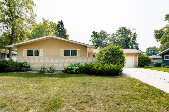 ranch-style home with a garage and a front yard