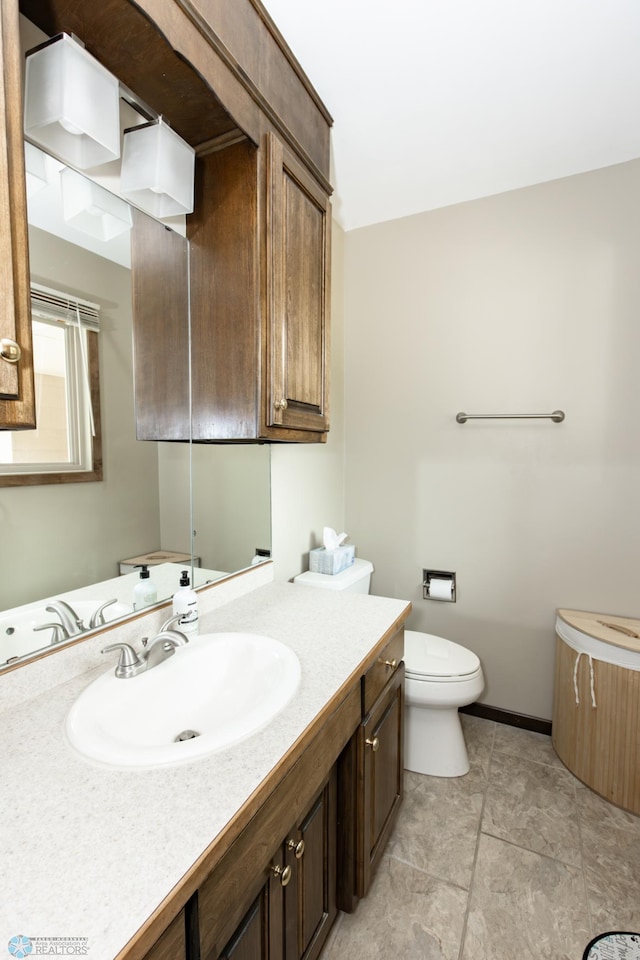 bathroom with vanity and toilet