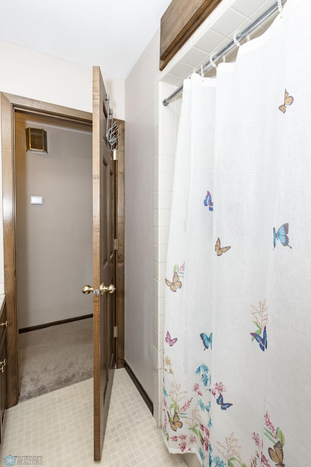 bathroom with vanity and a shower with curtain