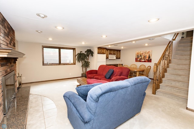 carpeted living room featuring a fireplace