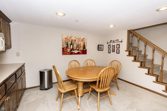 view of carpeted dining space