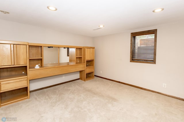 unfurnished bedroom featuring light colored carpet