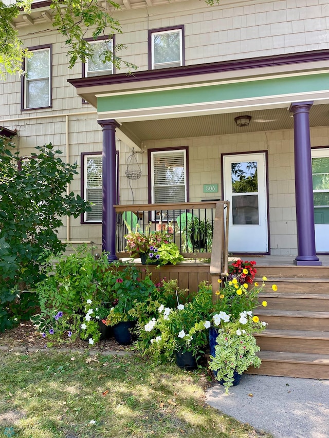 doorway to property with a porch