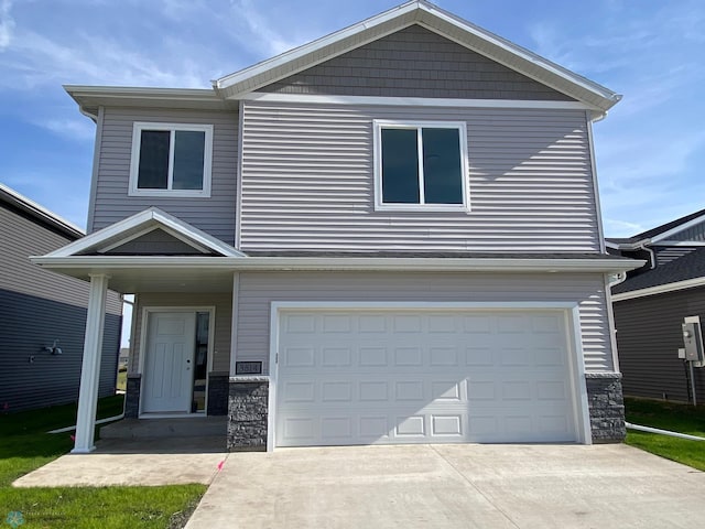 view of front of property with a garage