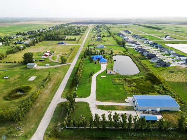 birds eye view of property with a rural view