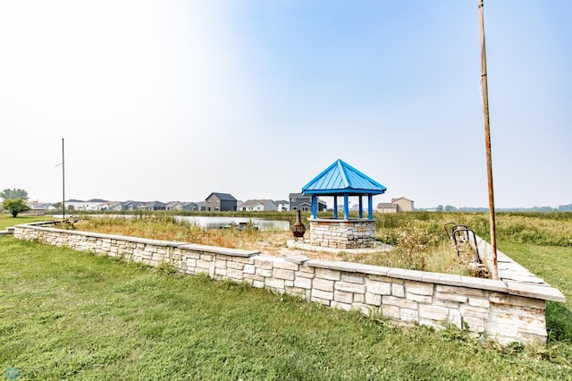 exterior space featuring a yard and a gazebo