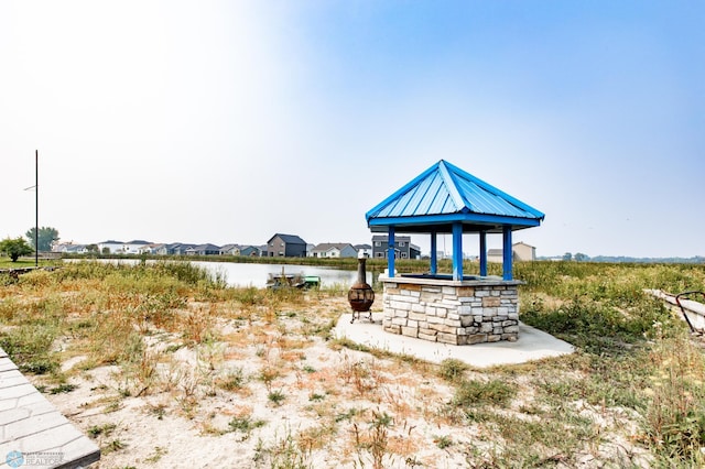 view of home's community with a gazebo and a water view