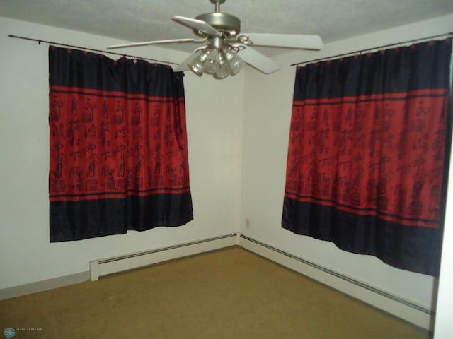 unfurnished room featuring a baseboard radiator, ceiling fan, and carpet flooring