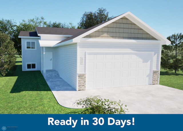 view of front of house featuring a front yard and a garage