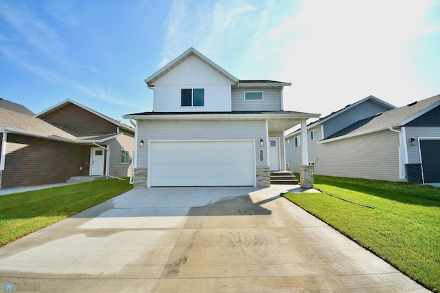 view of front facade with a garage and a front lawn