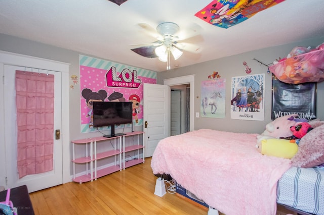 bedroom with ceiling fan and hardwood / wood-style floors