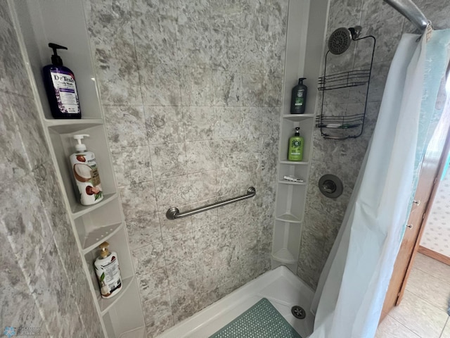 bathroom featuring tile patterned flooring and curtained shower