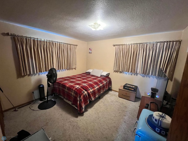 carpeted bedroom with a textured ceiling