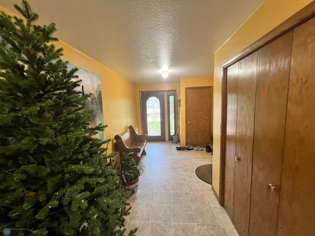 entrance foyer featuring a textured ceiling