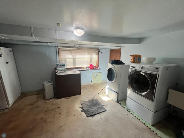 clothes washing area with washer and dryer