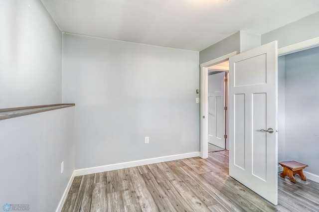 spare room featuring light hardwood / wood-style flooring