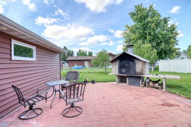 view of patio featuring a storage unit