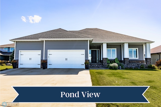 view of front of home featuring a garage and a front lawn