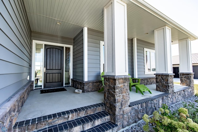 doorway to property with covered porch