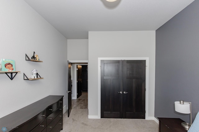 carpeted bedroom with a closet