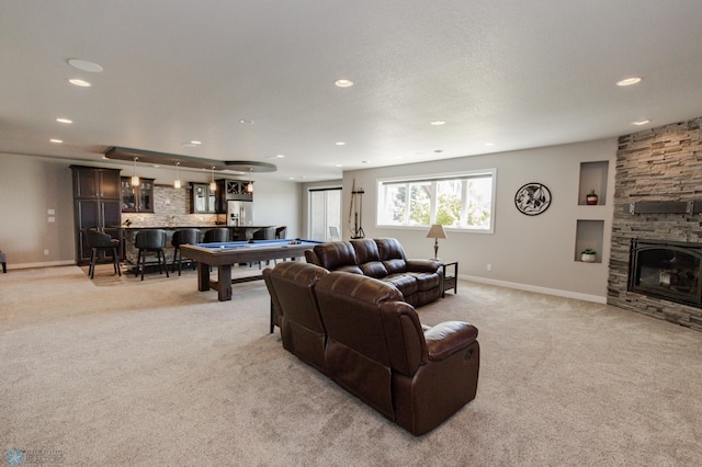 living room featuring a fireplace, bar, light colored carpet, and billiards