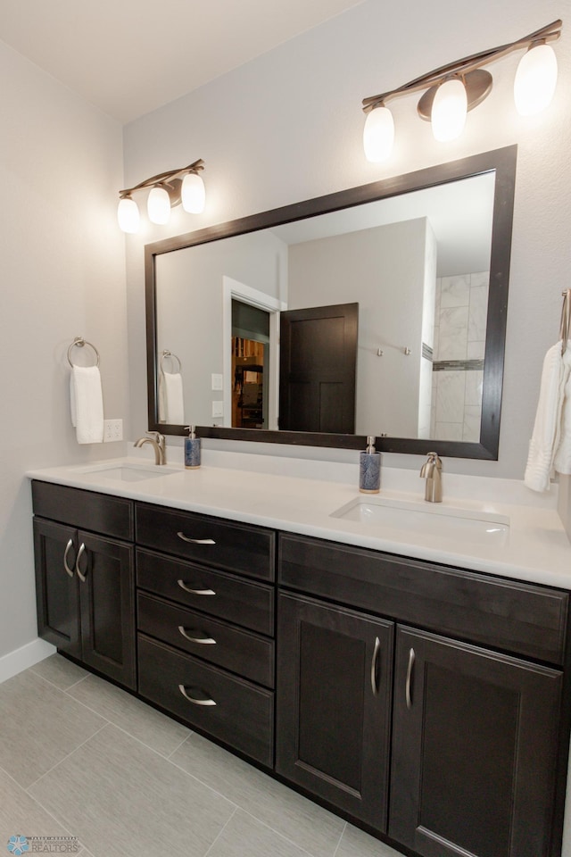 bathroom featuring tile patterned floors and vanity