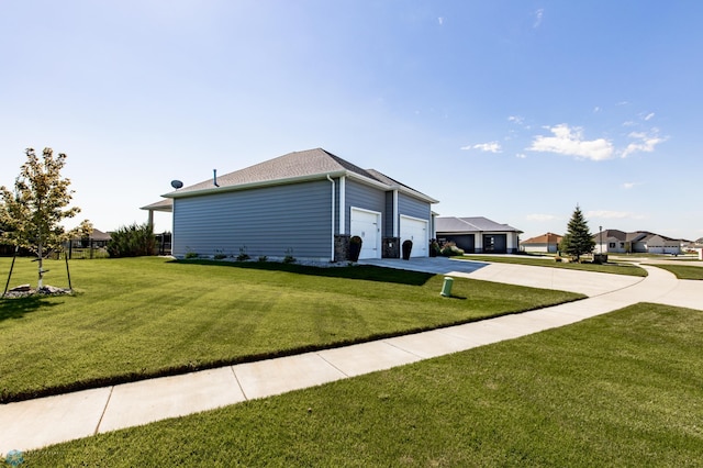 view of property exterior featuring a lawn and a garage