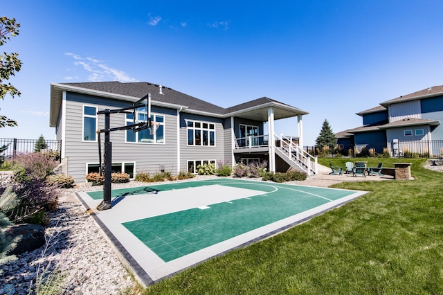 rear view of house featuring a patio and a lawn