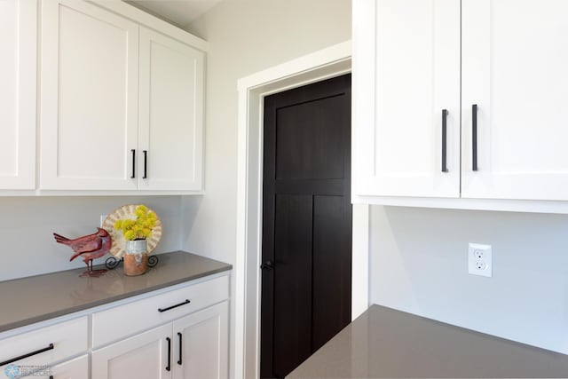 kitchen featuring white cabinets