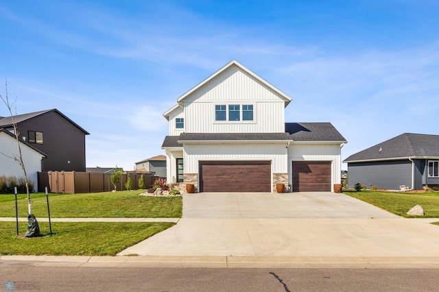 view of front of house with a garage and a front yard