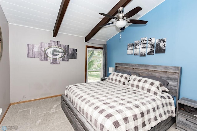 carpeted bedroom with ceiling fan and vaulted ceiling with beams