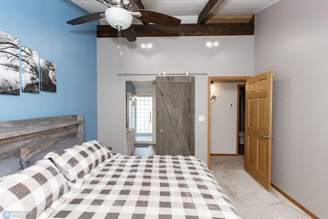 unfurnished bedroom with a barn door, wooden ceiling, beam ceiling, ceiling fan, and light colored carpet