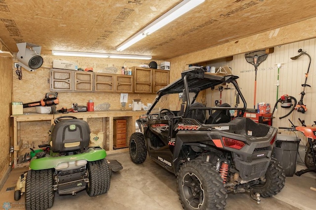 garage with a workshop area