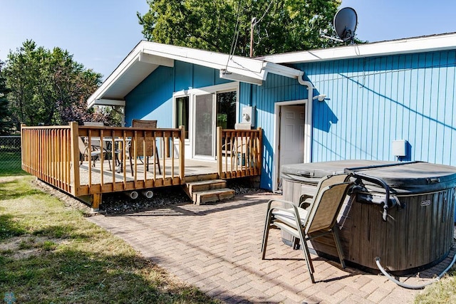 exterior space featuring a patio and a hot tub