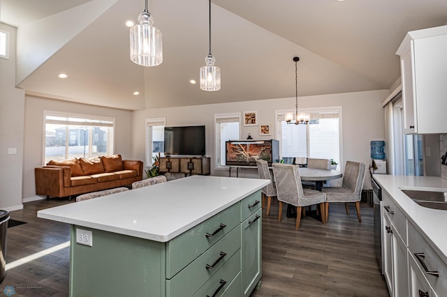 kitchen featuring white cabinets, green cabinetry, a center island, vaulted ceiling, and dark hardwood / wood-style flooring