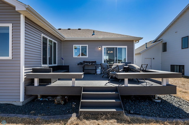 rear view of house with outdoor lounge area, a wooden deck, and central AC