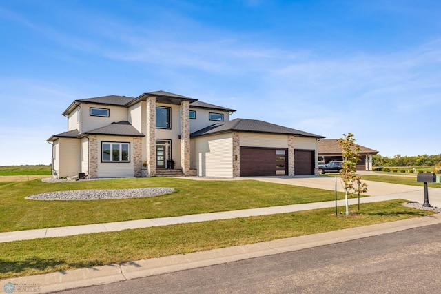 prairie-style home with a garage and a front yard