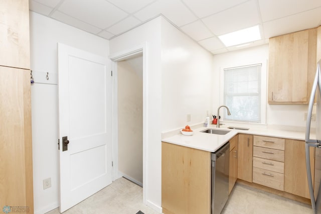 kitchen featuring a paneled ceiling, light brown cabinetry, sink, and stainless steel appliances