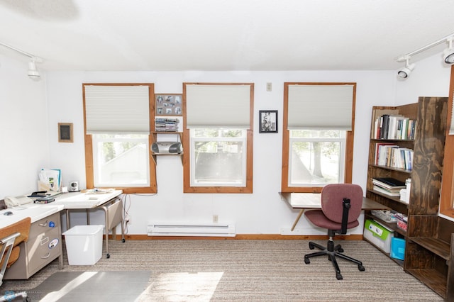 home office with light colored carpet, a baseboard heating unit, and rail lighting