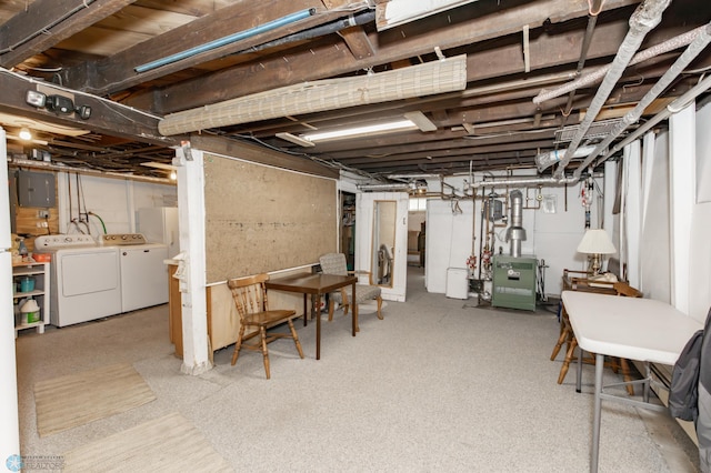 basement with electric panel and independent washer and dryer