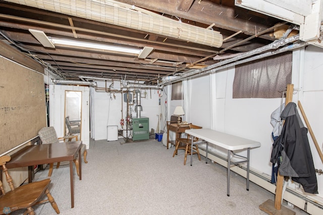 basement featuring a baseboard radiator