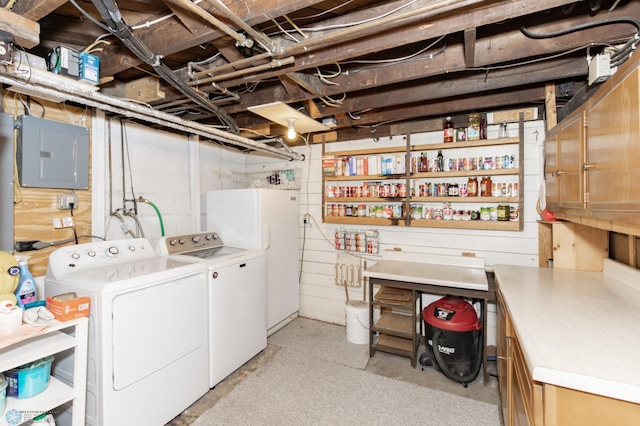 interior space featuring white refrigerator, electric panel, and separate washer and dryer