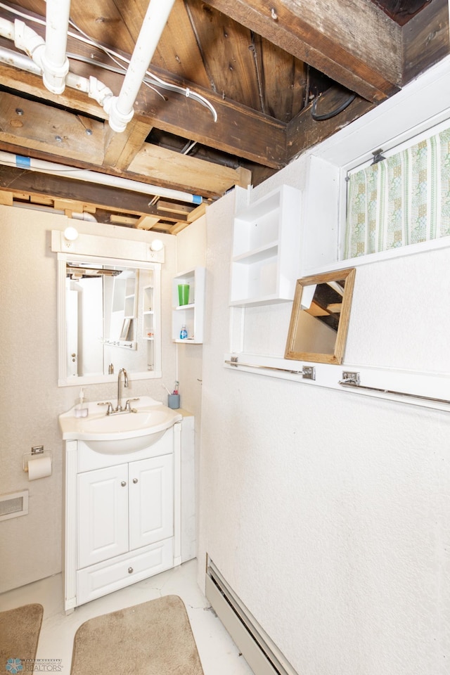 bathroom featuring concrete flooring and vanity