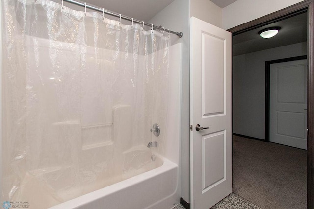 bathroom with shower / tub combo with curtain