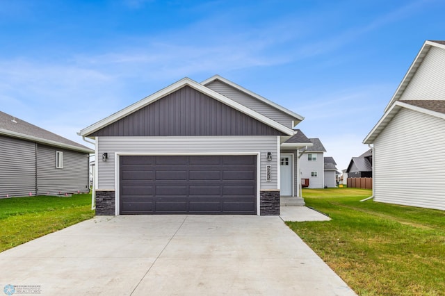 craftsman-style home featuring a front yard and a garage