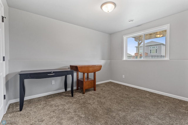 office area with carpet floors and lofted ceiling